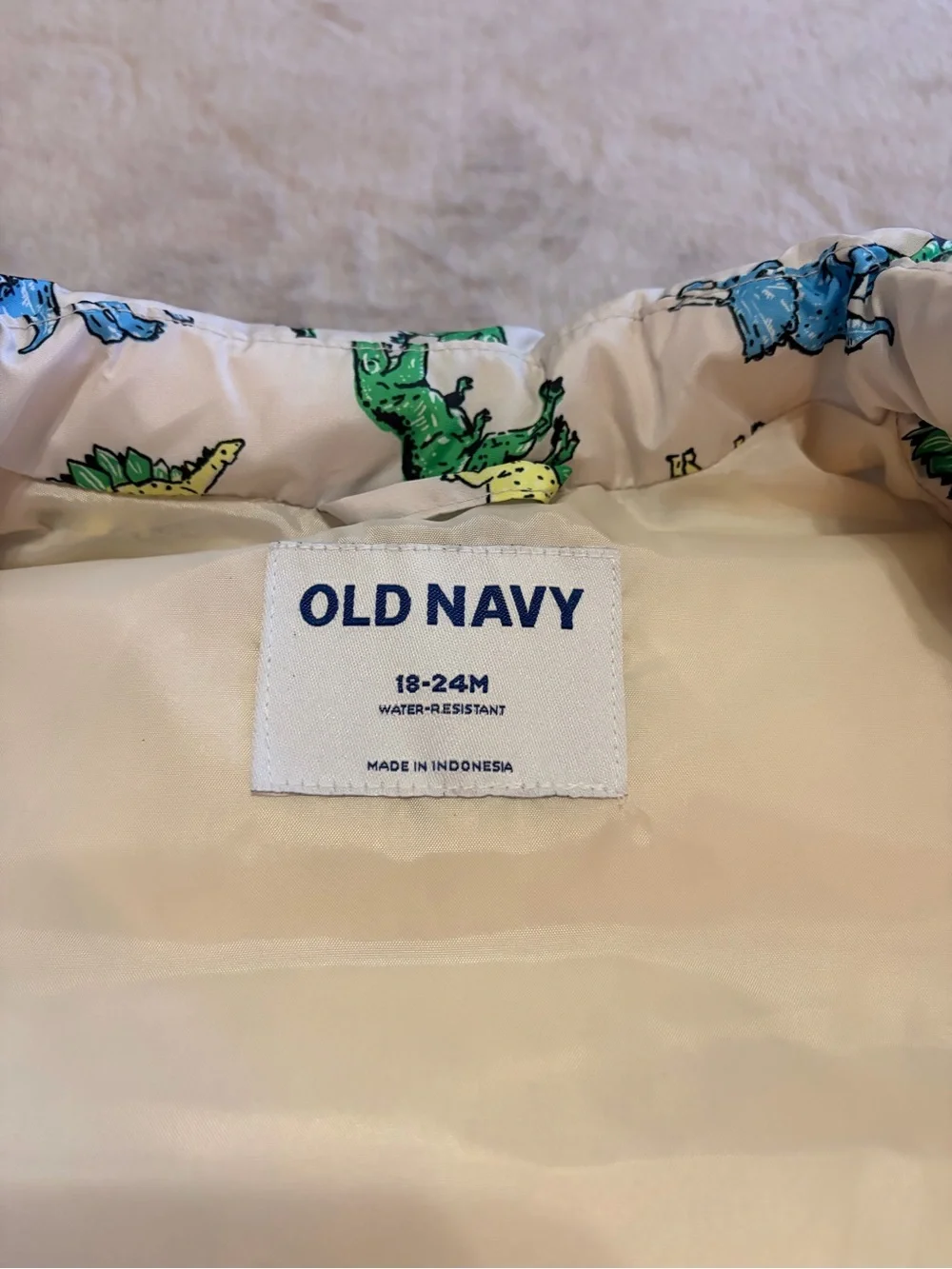 Old Navy White Kids Dino Puffer Vest with Green, Blue & Yellow Dinosaurs